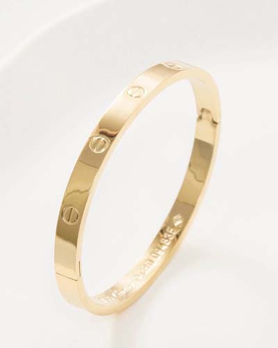 دستبند کارتیه لاو استیل مدل گرد طلایی