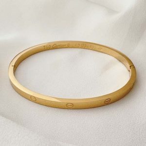 دستبند کارتیه لاو استیل مدل گرد طلایی نازک